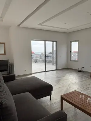 a living room with a couch and a coffee table at Caetana e Ferro in Calheta