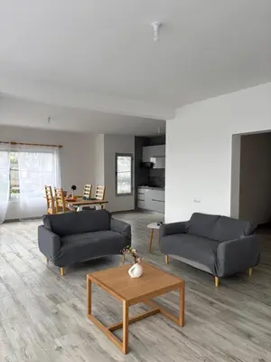 a living room with two couches and a coffee table at Caetana e Ferro in Calheta