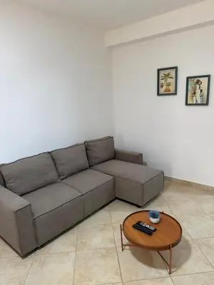 a living room with a couch and a coffee table at Santa Maria Firenze 1 by RPG Group in Santa Maria