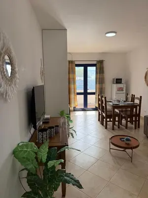 a living room with a table and a dining room at Santa Maria Firenze 1 by RPG Group in Santa Maria