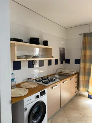 a kitchen with a washer and a washing machine at Santa Maria Firenze 1 by RPG Group in Santa Maria