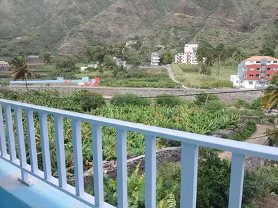a balcony with a view of a mountain at ROMANA guest house in Tarrafal da Vila de Ribeira Grande