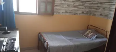 a small bedroom with a bed and a window at AnaSpace in Praia