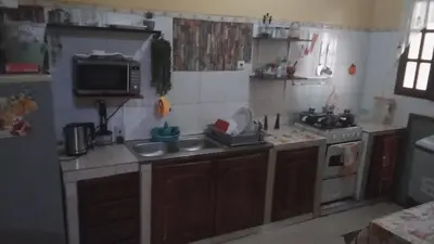 a kitchen with a sink and a stove at AnaSpace in Praia