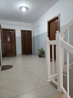 a hallway with three doors and a staircase at Golden Flow in Espargos