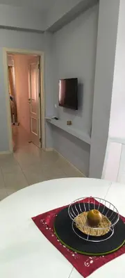 a room with a table with a plate of food at Pires's House in Mindelo