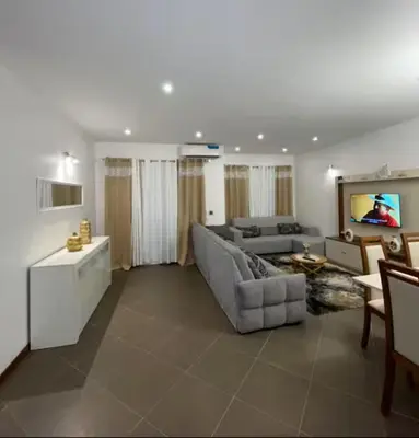 a living room with a couch and a table at Apartamento Vieira in Santa Maria