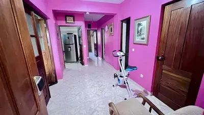 a pink hallway with a hair dryer in a room at Sossego e mar, Lazareto in Lazareto