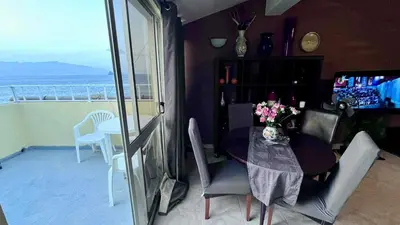 a dining room with a table and a view of the ocean at Sossego e mar, Lazareto in Lazareto