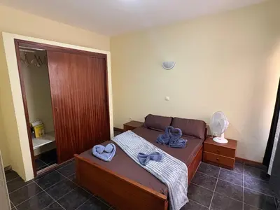 a bedroom with a bed with towels on it at P&SGuestHouse in Espargos