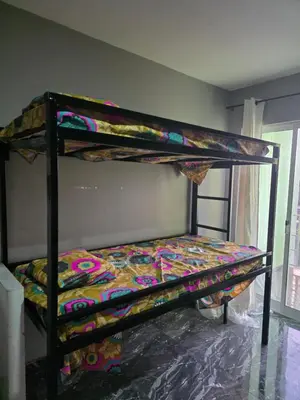 a bedroom with two bunk beds in a room at Mtechempire hostel in Espargos