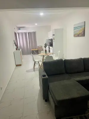 a living room with a couch and a table at Encanto do Mar in Santa Maria