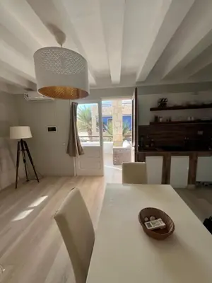 a living room with a white table and chairs at Ca' Zen in Sal Rei
