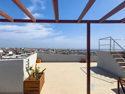 a balcony with a view of the city at Spacious 2 bdr aprt, rooftop pool - LCGR in Praia