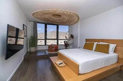 a bedroom with a large bed and a large window at Mindelo Sunset Ocean Views near Laginha Beach in Mindelo