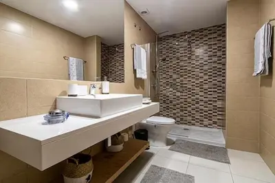 a bathroom with a sink and a toilet at Mindelo Sunset Ocean Views near Laginha Beach in Mindelo