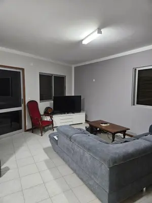 a living room with a couch and a tv at I love TANK in Caculi