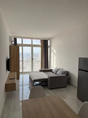 a bedroom with a bed and a large window at AQUÁRIO Hotel in Sal Rei