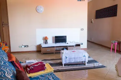 a living room with a couch and a table at aparthotelboavista-net in Sal Rei