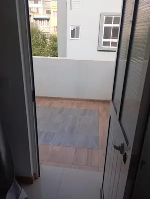 an open door to a room with a view at Ti Jona Rooms in Mindelo