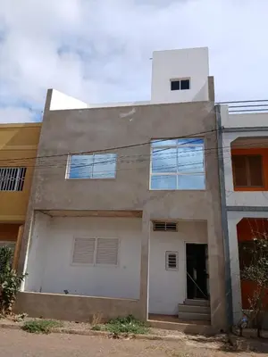 a building with a lot of windows on it at Ti Jona Rooms in Mindelo