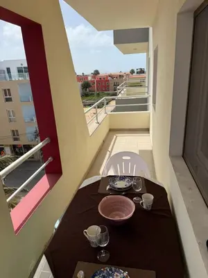 a table and chairs on a balcony with a view at Apartament ROSA DEI VENTI 3D Estoril Sal Rei in Sal Rei