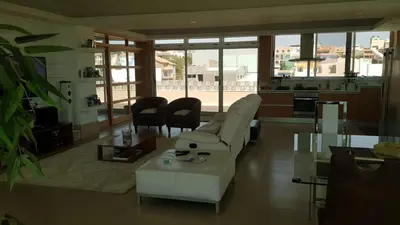 a living room with a couch and a table at C Varela C - Casa Branca in Praia