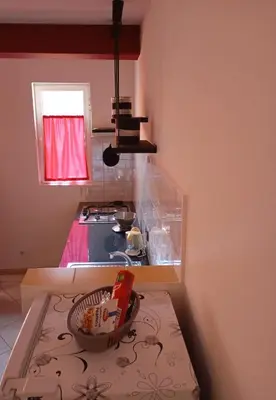 a kitchen with a sink and a bowl on a table at Rosa dei venti 4 in Santa Maria