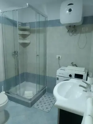 a bathroom with a shower and a sink and a toilet at Ca' Dolce Vita in Santa Maria