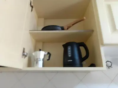 a cupboard with a tea pot and a tea kettle at Ca' Dolce Vita in Santa Maria