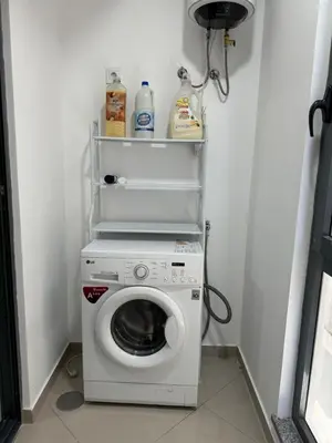 a washer and dryer in a small room at Holiday AP TF 2 in Praia