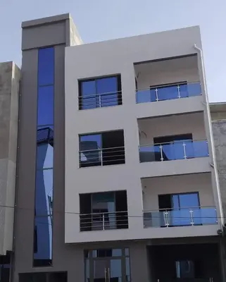 an apartment building with balconies on the side of it at Apartamento T3 palmarejo center in Praia