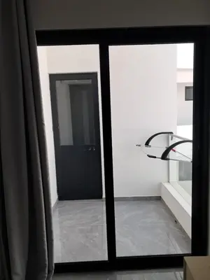 a view of a room with a glass door at Apartment T3 located Rua 4 de Julho Sal Rei blv in Sal Rei