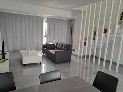 a living room with a couch and a table at Apartment T3 located Rua 4 de Julho Sal Rei blv in Sal Rei