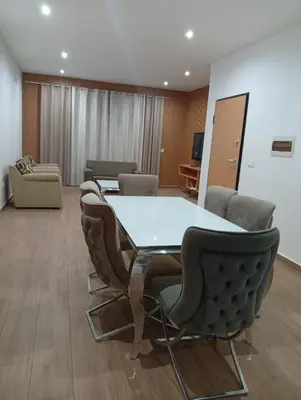 a conference room with a table and chairs at Praia Sunset Horizon Apartment