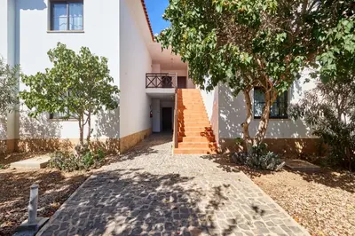 a building with stairs and trees in front of it at T2 Santa Maria, Ilha do Sal, Cabo Verde - Melia Tortuga Beach Resort in Prainha