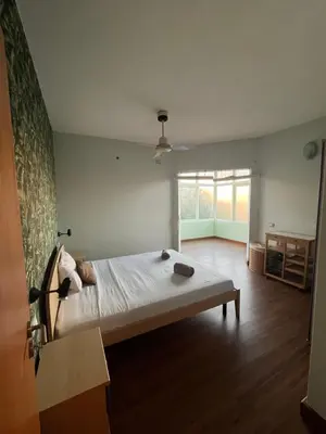 a bedroom with a large bed and a large window at WIND Ocean View Lobster Dinner Included in Santa Maria