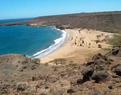 a group of people on a beach with the ocean at Prainha Beach Home in Praia