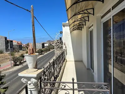 a balcony of a house with a view of a street at Villa Esperança in Tarrafal