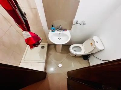 a small bathroom with a sink and a toilet at Villa Esperança in Tarrafal