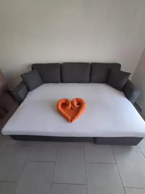 two hearts sitting on top of a bed at Apartamento Estoril in Sal Rei