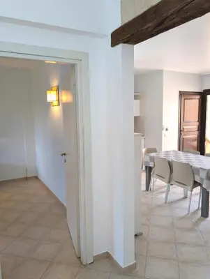 a kitchen and dining room with a table and chairs at SUNSENT GLOW - Tropical Apt N11 - PointingCaboVerde in Santa Maria
