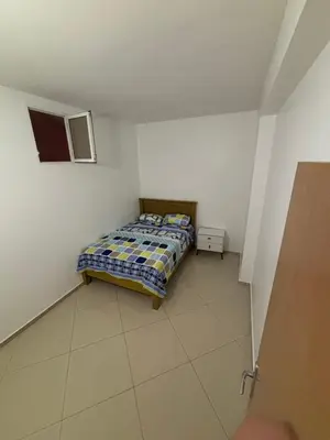 a small bedroom with a bed in a room at La casa de iman in Praia