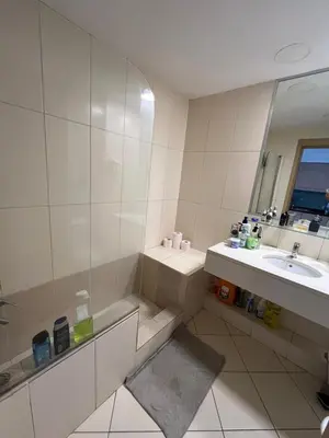 a bathroom with a sink and a tub and a mirror at Vila Verde cozy studio in Prainha