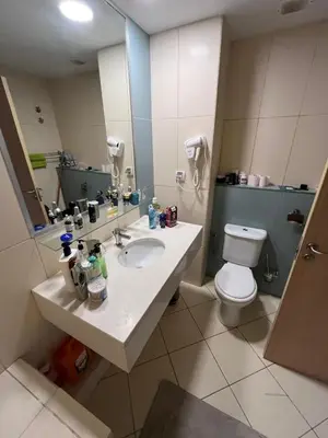 a bathroom with a sink and a toilet and a mirror at Vila Verde cozy studio in Prainha