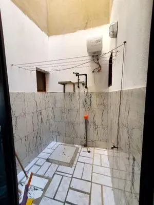 a bathroom under construction with a tiled floor at Comfort T2 in Espargos