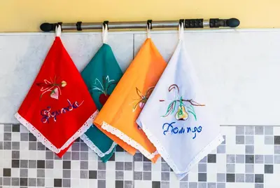 a group of four towels hanging on a rack at Quinta Toca do leão in Ribeira Grande
