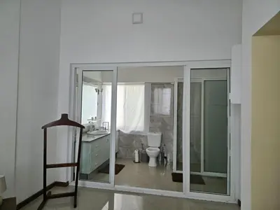 a bathroom with a toilet and a sink at Diva Apartamento in Praia