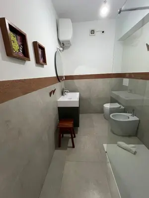 a bathroom with a sink and a toilet at Extraordinary sea view in Sal Rei
