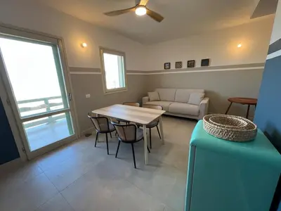 a living room with a table and a couch at Extraordinary sea view in Sal Rei
